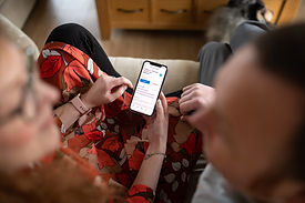 couple-looking-at-phone-screen-at-personal-brand-shoot.jpg