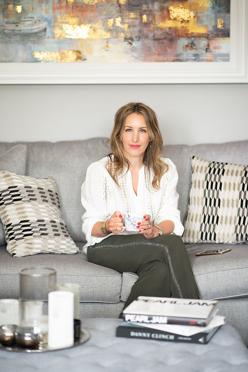 aberdeen-make-up-nail-artist-sitting-on-sofa-in-living-room-looking-at-photographer-camera