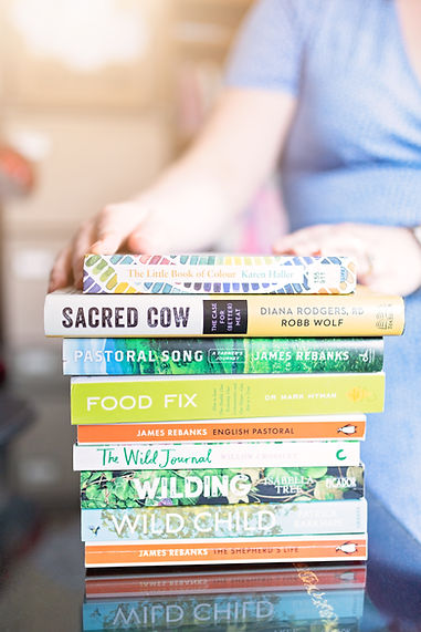 stack-of-books-from-personal-brand-photo-session-with-nutrition-coach-in-aberdeen.JPG