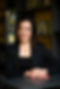 woman-dressed-in-black-posing-for-corporate-headshot-with professional-brand-photographer-