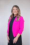 woman-in-fuschia-pink-blazer-and-blac-dress-posing-for-corporate-headshot-in-aberdeen-scot