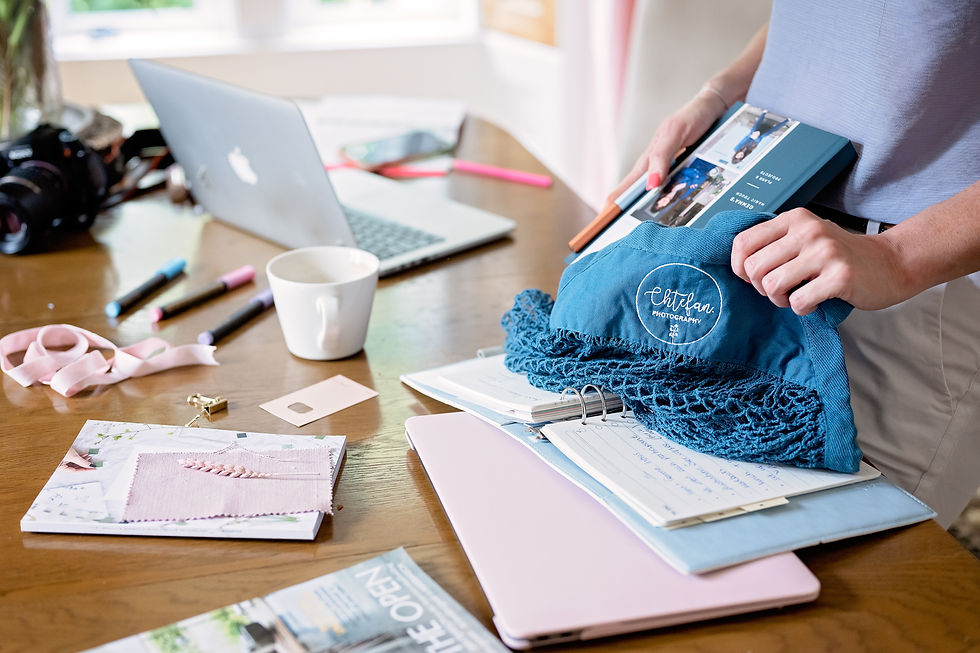 table-with-stationery-and-office-items-and-woman-hands-at-content-photoshoot-in-scotland.J