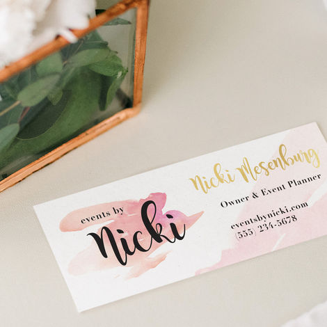 Business card for Events by Nicki on a table