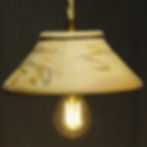 baladeuse en grès roux allumée suspendue