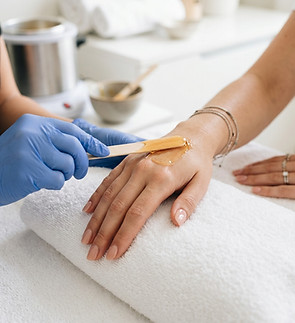 Women Hands waxing at Ipanema Beauty & Spa, Orlando