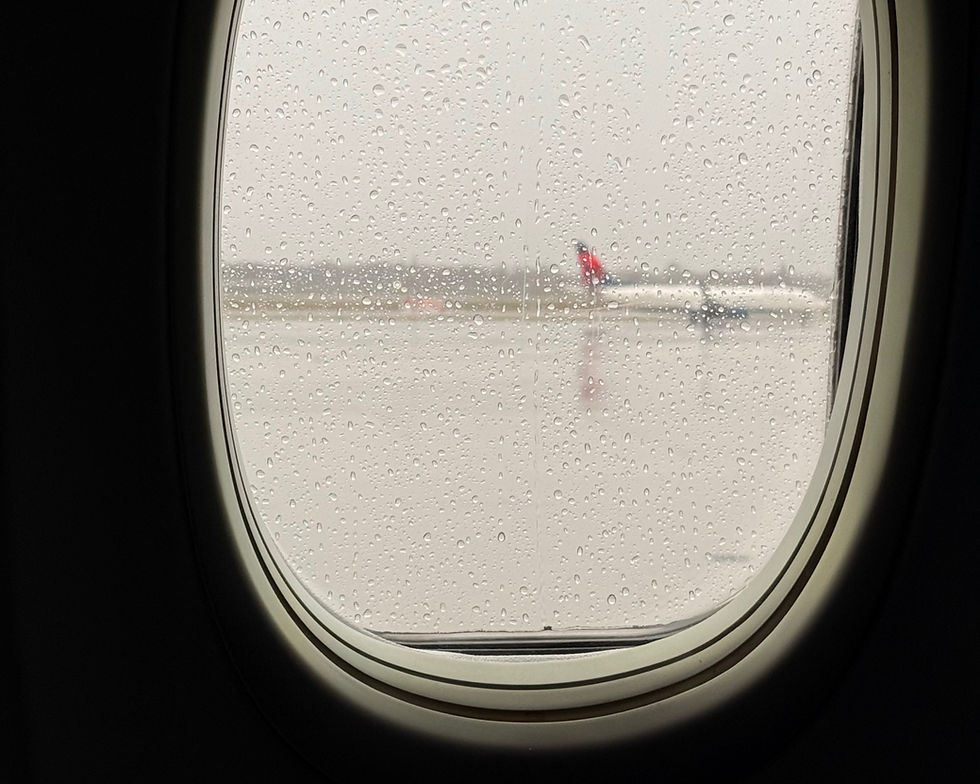 Eye-level view of a family boarding an airplane with toddlers and preschoolers