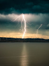 Single lightning over wind farms