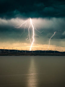 Single lightning over wind farms