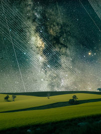 Satellites strikes over canola fields and Milky Way