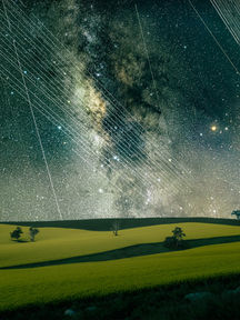 Satellites strikes over canola fields and Milky Way