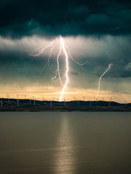 Single lightning over wind farms