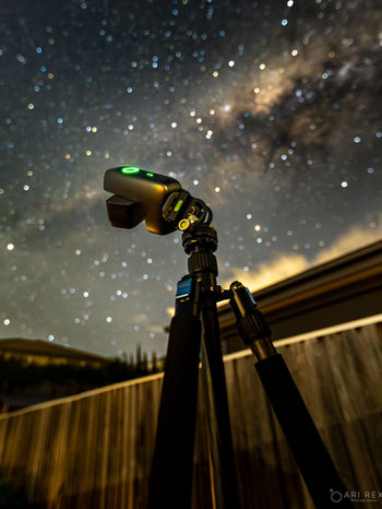 Camera on tripod capturing the Milky Way at night.