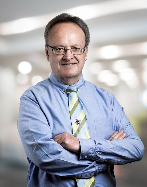 Professional corporate portrait of a man in an office
