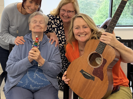 Ellen Holden shared smiles and laughter with her daughter Erin, Nurse Case Manager Terry Brooks, and NJHealth Music Therapist Karen Melia.