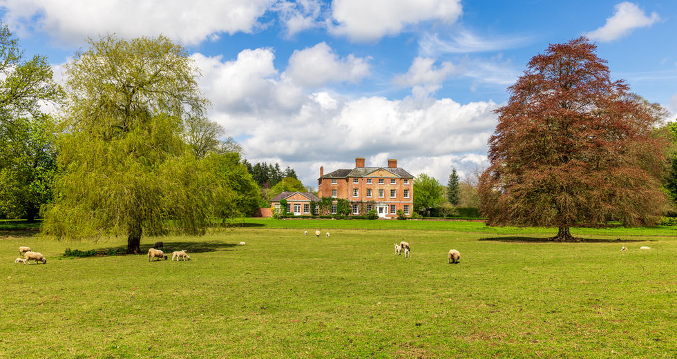 The Old Rectory at the Pudleston Estate viewed from the surrounding farmland