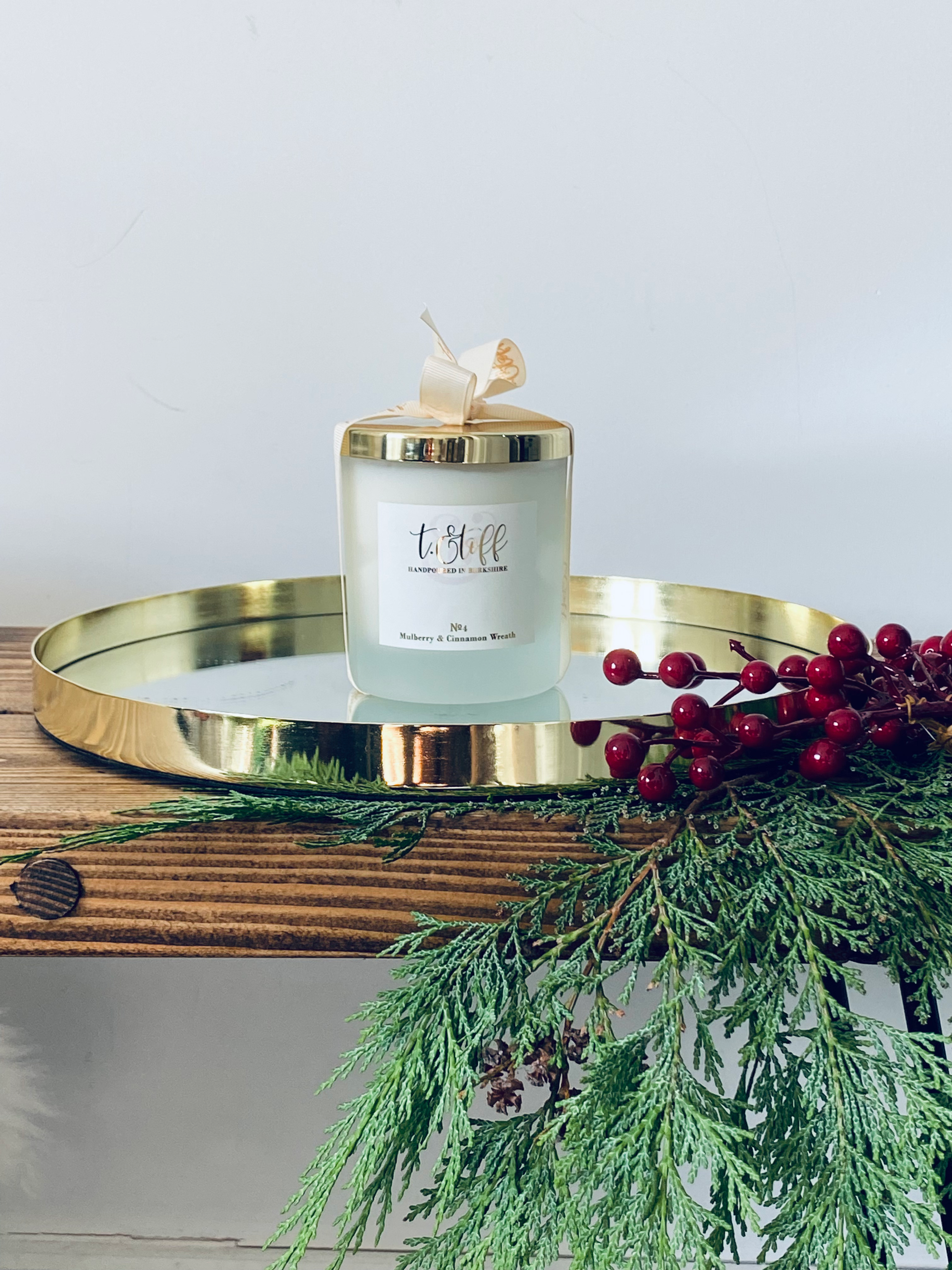 Handmade Christmas candle with Christmas fur and berries