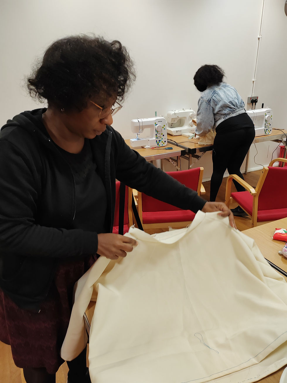 Woman handling fabric in a local sewing class