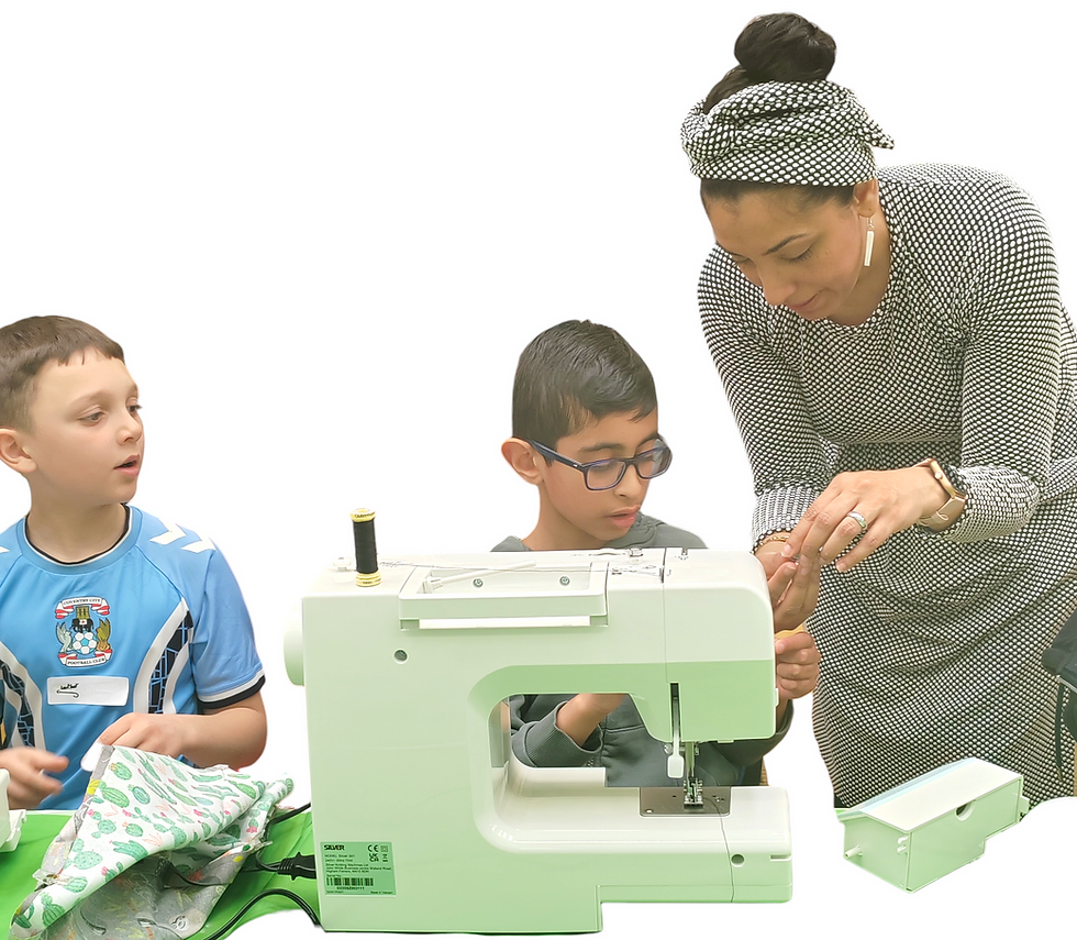 Instructor teaches boys in local sewing classes for beginners.