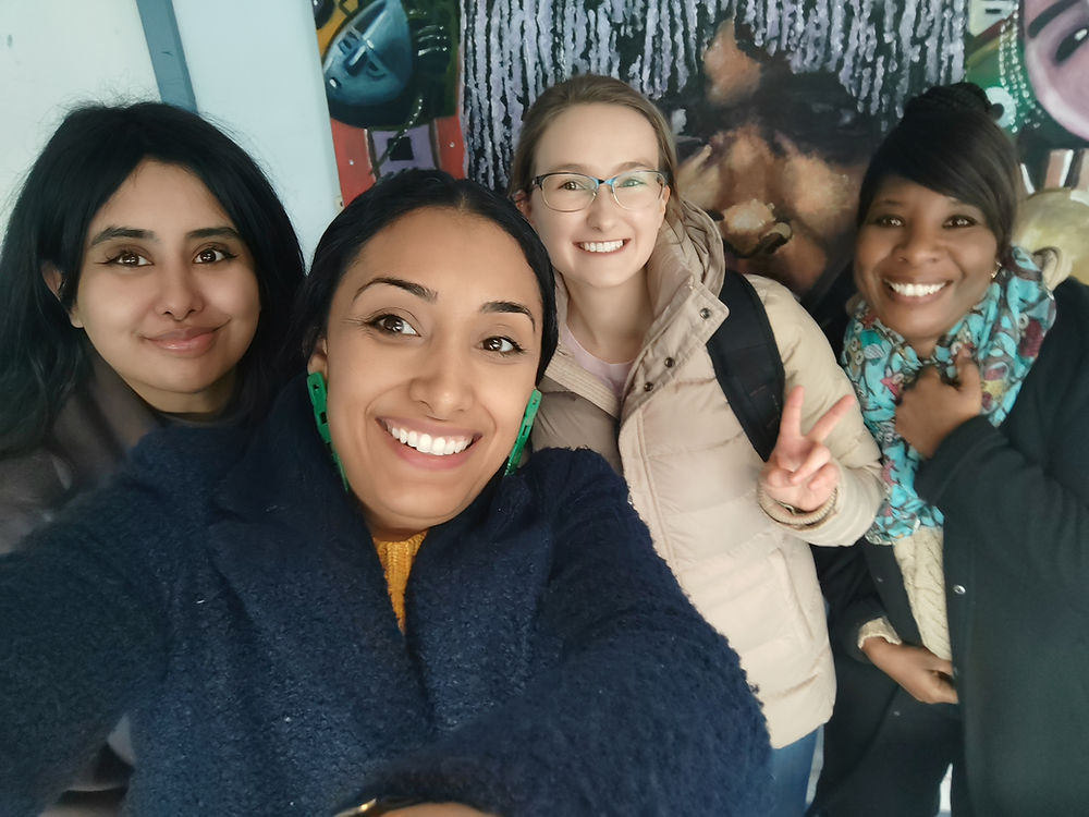 Ladies from the sewing class smiling with Jade