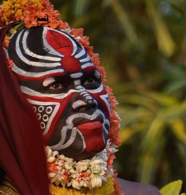 Guliga Panjurli Daiva with ferocious face.