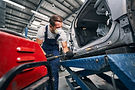 repairman-peening-car-with-tool-for-removing-dents-2025-03-06-14-14-28-utc.jpg