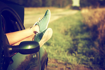 feet out of car window