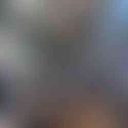 the inside of lau pa sat hawker center with lots of tables and chairs in the middle with food stalls on the edges