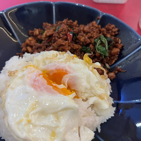plate with rice and fried egg over some minced meat