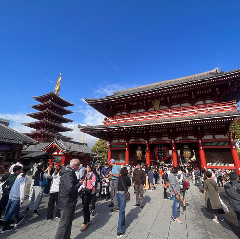 the shensoji shrine with lots of people milling about