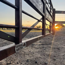 Rural Gates Australia Logo on Acreage Double Swing Gates with Sun setting in Background Bundaberg