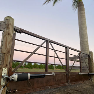 Entrance Gates for Rural Property in Australia of Steel Farm Gates with Automatic Gate Openers from Richmond Castors, Built by Woods West Metalworks Bundaberg