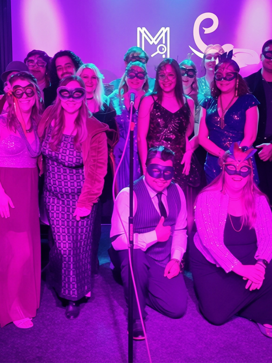 a group dressed in masquerade attire