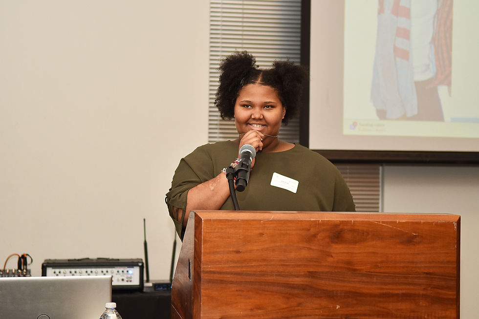 Eye-level view of a youth leadership workshop room with chairs and a whiteboard