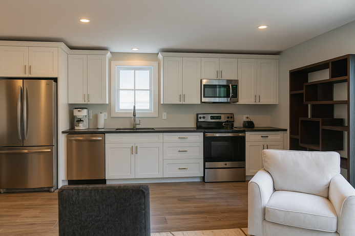 The Argyle kitchen interior with cabinetry, appliances, and efficient compact living workspace