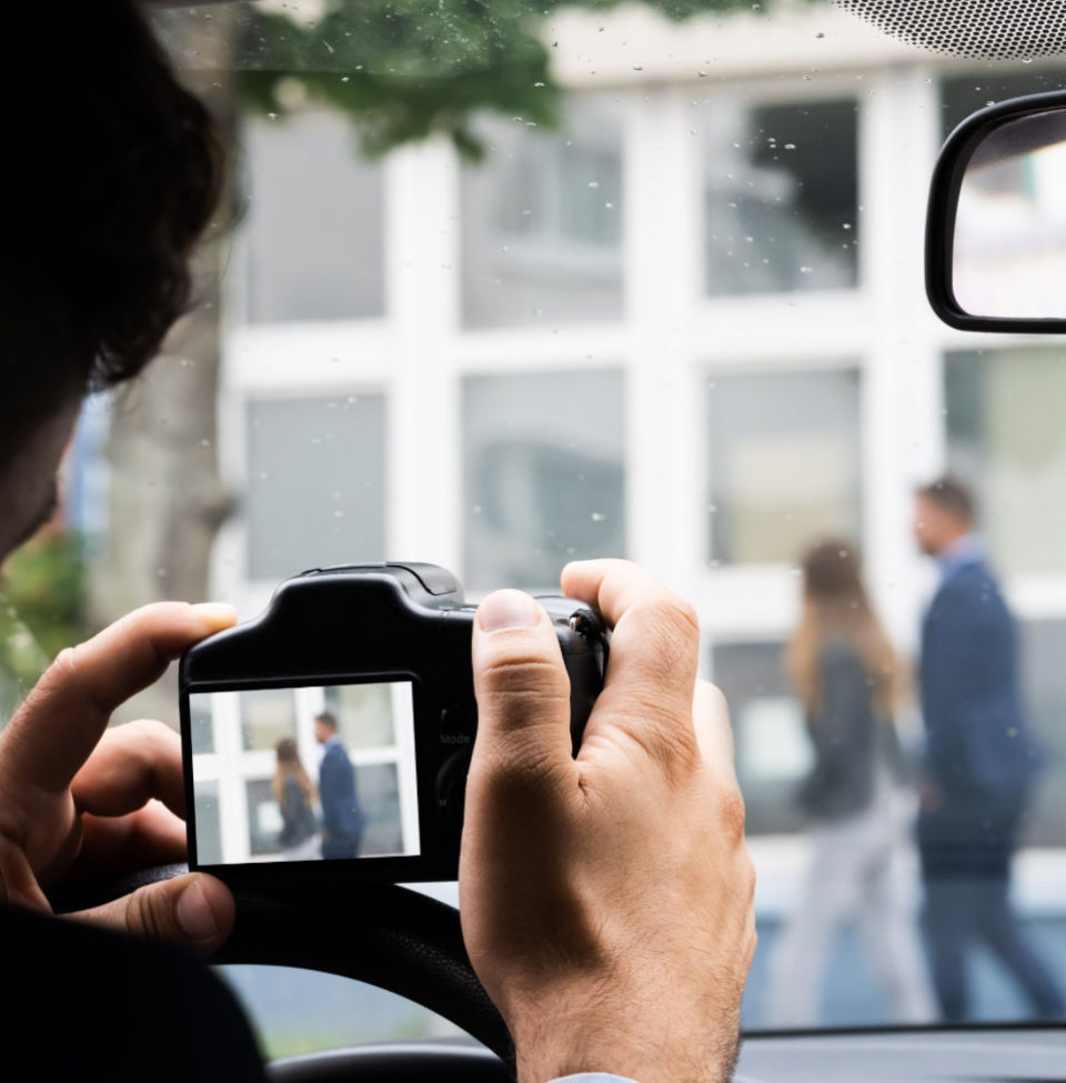 Taking pictures of a woman cheating on a man