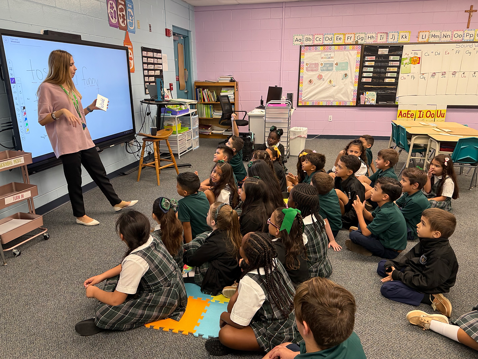 Eye-level view of a classroom with children reading and a crucifix on the wall