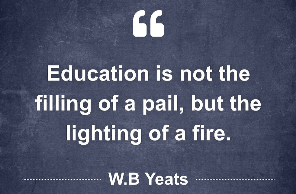 Quote on blackboard background: "Education is not the filling of a pail, but the lighting of a fire." - W.B Yeats. White text with quotation marks.