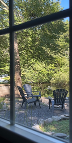 Photo by Ronda Media showing a peaceful view through the window of a cottage at Echo Valley Cottages in East Stroudsburg, PA