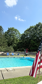 Poolside photo captured by Ronda Media for Echo Valley Cottages in East Stroudsburg, PA, showcasing a relaxing summer day