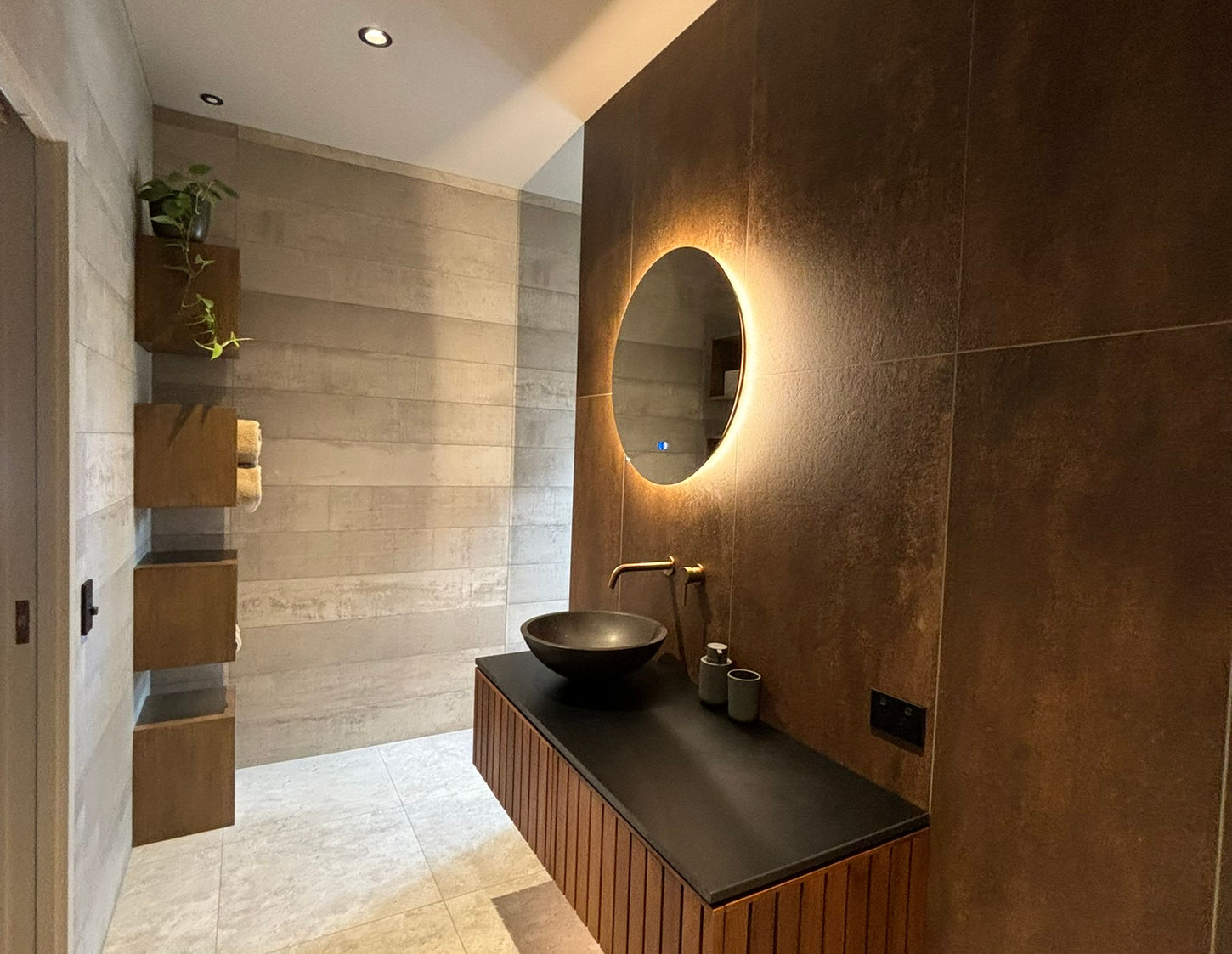 Modern bathroom design with dark wood floating vanity
