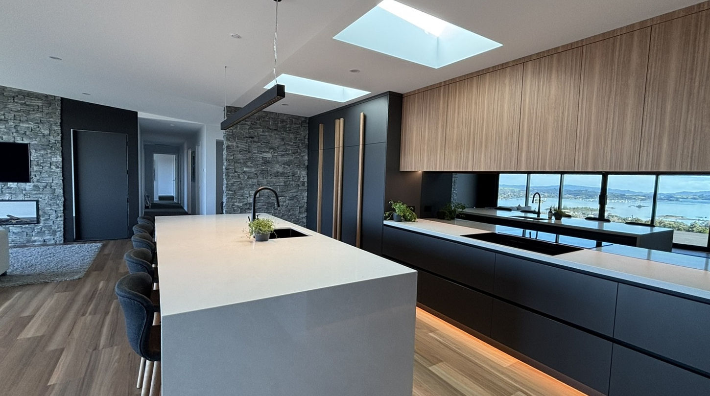 Modern kitchen design: island, cabinetry, and lake view