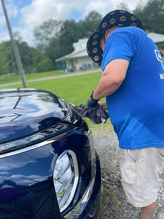 George cleaning grill.jpg