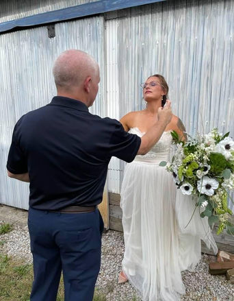 Keeping the gnats away from my 10_9_21 bride, Jessica Boyd, with vanilla spray.JPG