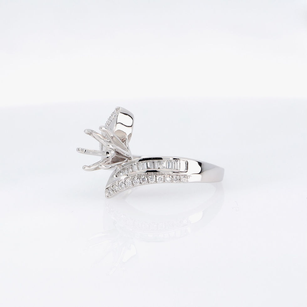 Thumbnail: Elegant gold diamond solitaire ring with round and baguette diamonds