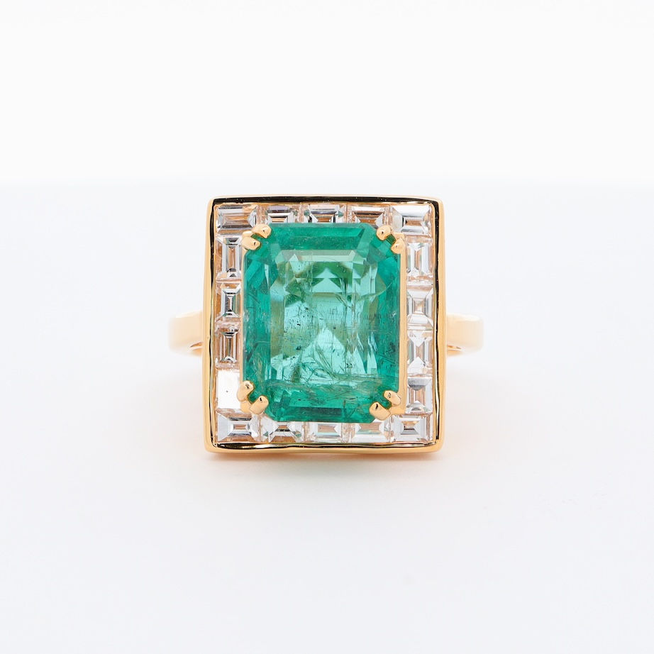 Geometric Art Deco halo diamond engagement ring setting with channel-set baguette diamonds.