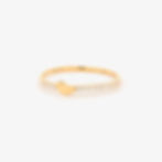 Minimalist heart diamond ring with a polished gold heart on a pavé diamond band.