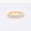 Thumbnail: Classic diamond wedding band with shared-prong round brilliant diamonds in a fine gold setting.