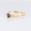 Thumbnail: Delicate sapphire diamond engagement ring with oval blue gemstone and side diamonds