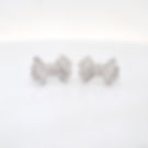 Whimsical pavé diamond earrings in a classic bow design, handcrafted in fine gold.