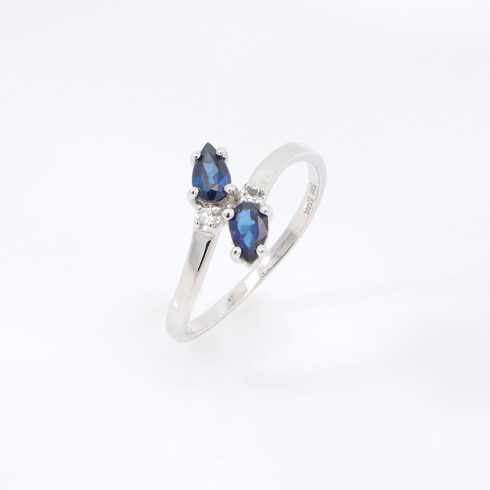 Modern bypass sapphire ring in gold with diamonds - contemporary custom jewelry by SVS Jewelry Bangkok